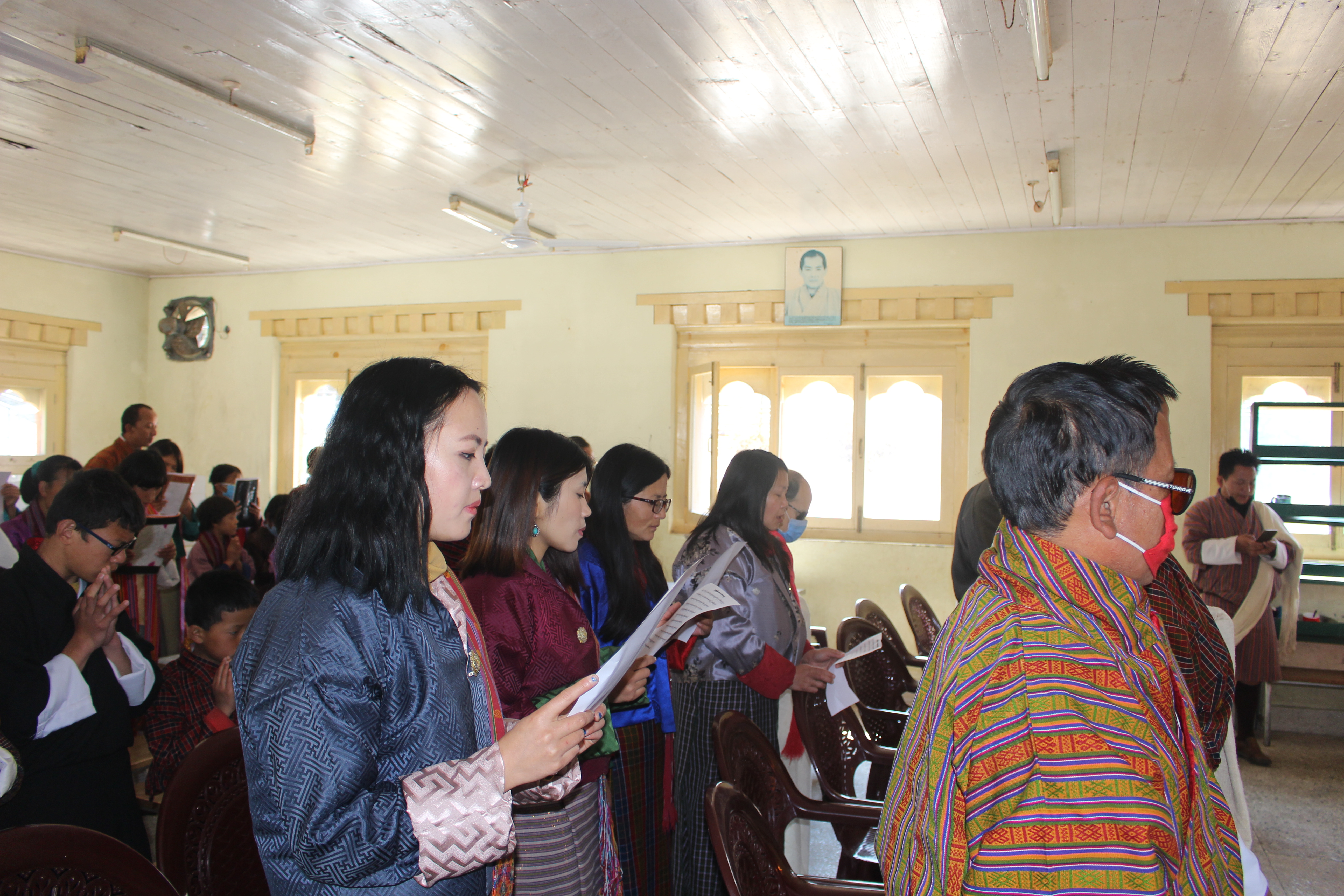 photo: Staff and Students Praying.